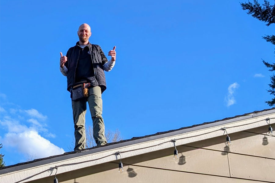 Michael Hanes, certified home inspector, pictured inspecting the roof of a home during a home inspection.